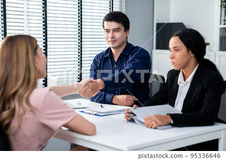 Young female asian candidate tries to impress interviewer by being competent. 95336646
