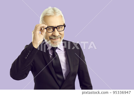 Portrait of happy handsome senior man dressed in classic suit and stylish glasses 95336947