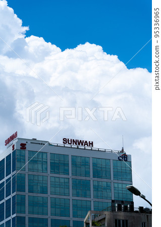 Famous buildings standing in the center of Ho Chi Minh City and thunderheads floating in the blue sky 95336965