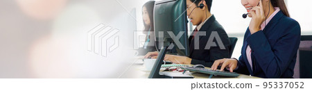 Business people wearing headset working in office in widen view Business people wearing headset working in office in widen view 95337052