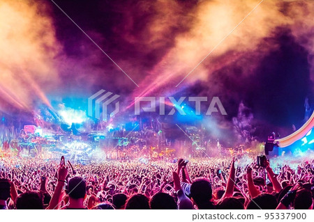 Crowd of people in music festival at spectacular night concert 95337900