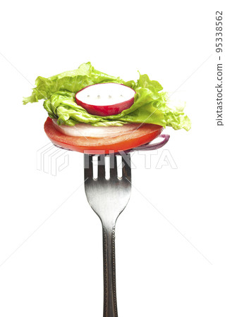 vegetables on a fork, red onion, radish,bell pepper,lettuce,tomato. vegetables on a fork, red onion, radish,bell pepper,lettuce,tomato. 95338562