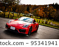 Autumn leaves and cars in Okutadami 95341941