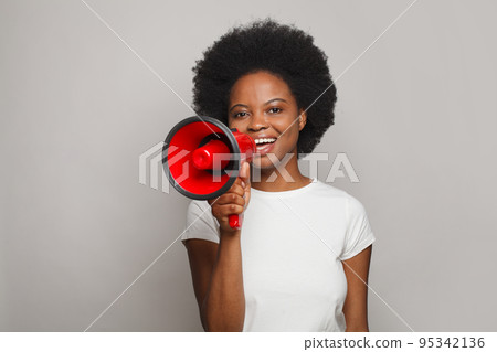 Young brunette woman screaming in megaphone. Leadership, attention, advertisement Young brunette woman screaming in megaphone. Leadership, attention, advertisement 95342136