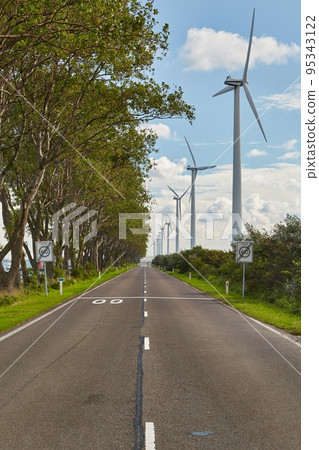 Road on a narrow waterside land in the Port of Rotterdam 95343122