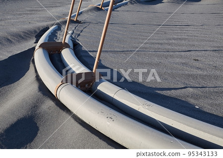 Pipes running on the ground 95343133