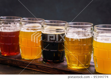 Tasting different types of beer 95344774