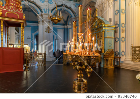 Burning candles in a Christian Orthodox church Burning candles in a Christian Orthodox church 95346740