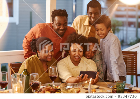 Family using Video Call at Dinner 95347730