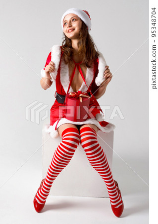 Beautiful happy woman holding a Christmas gifts 95348704