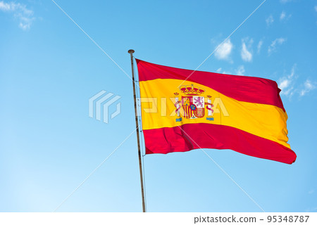 National Flag of Spain on blue sky background National Flag of Spain on blue sky background 95348787