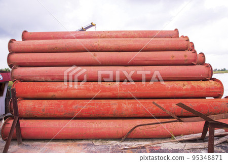 Rusted iron steel metal pipes stack an industrial field Rusted iron steel metal pipes stack an industrial field 95348871