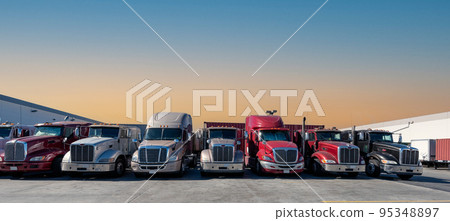 Semi-trailers lined up at the warehouse berth Sunset Semi-trailers lined up at the warehouse berth Sunset 95348897