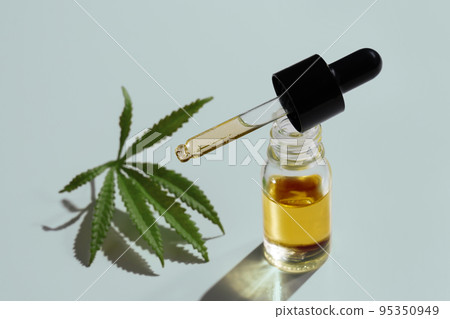Set of legalized marijuana features with CBD oil product, hemp leaf and bud. 95350949