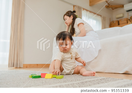 Mother suffering from child rearing 95351339