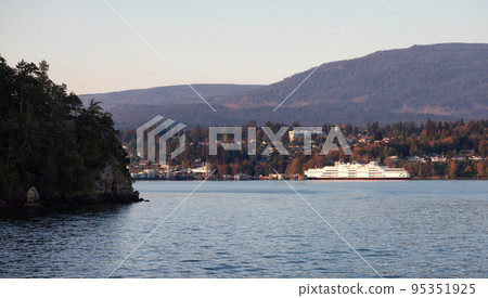 City by the water, Marina with Boats, surrounded by Homes, mountains and trees. Fall Season 95351925
