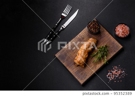 Tasty baked meat roll of chicken meat, sweet pepper with spices and herbs Tasty baked meat roll of chicken meat, sweet pepper with spices and herbs 95352389