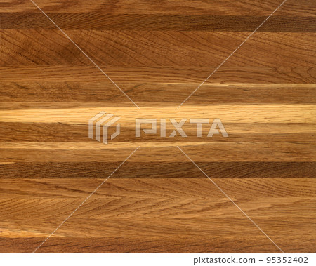 Brown Beige Texture of stained oak wood with grain, fragment of a wooden panel hardwood. surface bark is used as natural background, web page, board, table. Contrasts and symmetries. Space for text. 95352402