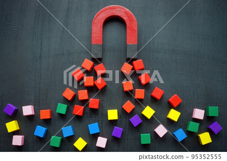 The magnet attracts colored cubes. Leads generation and acquisition concept. The magnet attracts colored cubes. Leads generation and acquisition concept. 95352555