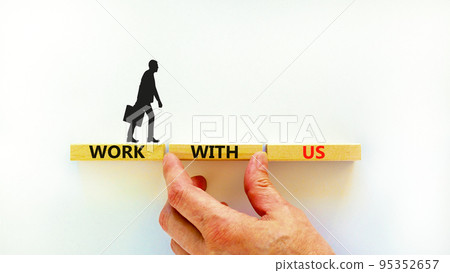 Work with us symbol. Concept words Work with us on wooden blocks on a beautiful white table white background. Businessman hand. Business, motivational and work with us concept. Copy space. Work with us symbol. Concept words Work with us on wooden blocks on a beautiful white table white background. Businessman hand. Business, motivational and work with us concept. Copy space. 95352657