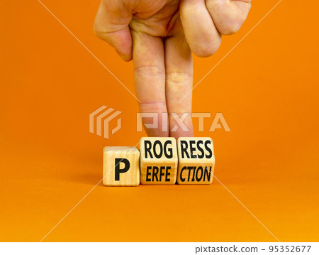 Progress or perfection symbol. Concept words Progress or Perfection on wooden cubes. Businessman hand. Beautiful orange table orange background. Business progress or perfection concept. Copy space. Progress or perfection symbol. Concept words Progress or Perfection on wooden cubes. Businessman hand. Beautiful orange table orange background. Business progress or perfection concept. Copy space. 95352677