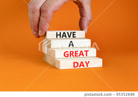 Have a great day symbol. Concept words Have a great day on wooden blocks. Beautiful orange table orange background. Businessman hand. Business, psychological Have a great day concept. Copy space. Have a great day symbol. Concept words Have a great day on wooden blocks. Beautiful orange table orange background. Businessman hand. Business, psychological Have a great day concept. Copy space. 95352696