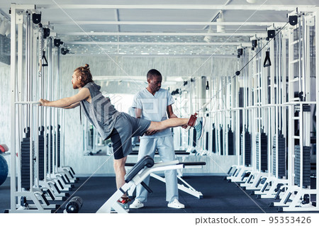 Therapist training patient during rehabilitation 95353426