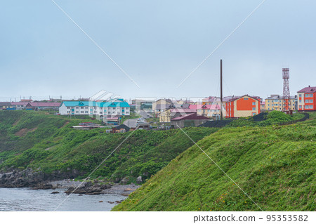 view of the town of Yuzhno-Kurilsk on the island of Kunashir view of the town of Yuzhno-Kurilsk on the island of Kunashir 95353582