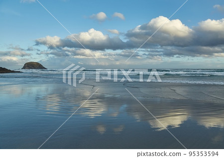 Sandy beach clouds landscape 95353594
