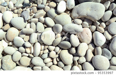 Texture of white sea stones close-up, round smooth stones. For design, background, postcards, collages and compositions 95353997