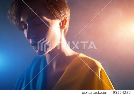 young ukrainian woman in yellow and blue clothes and dress praying for ukraine 95354223