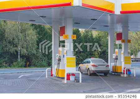 Guns for refueling at a gas station. 95354246