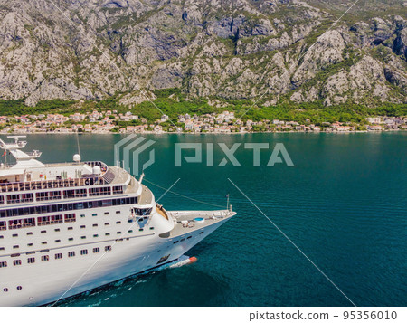 Luxury passenger liner in the bay of Kotor with travel returning after the Covid 19 pandemic Luxury passenger liner in the bay of Kotor with travel returning after the Covid 19 pandemic 95356010