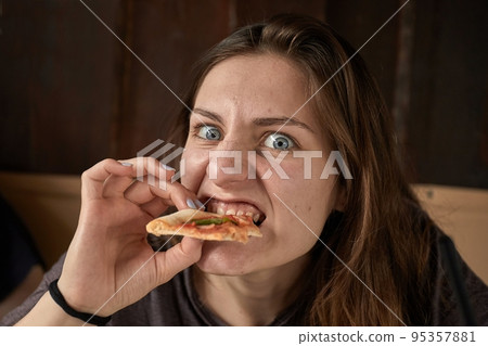 Girl eating pizza Girl eating pizza 95357881