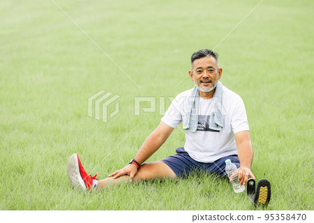 Disabled man with prosthetic leg 95358470