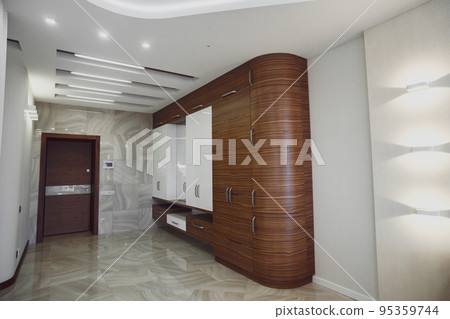 Wooden cabinet in modern hallway interior with marble floor Wooden cabinet in modern hallway interior with marble floor 95359744