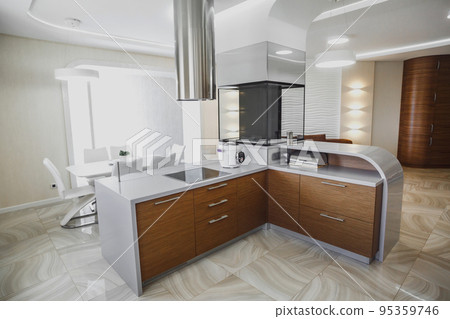 View of luxury modern fitted kitchen with stainless steel appliances View of luxury modern fitted kitchen with stainless steel appliances 95359746