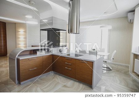 View of luxury modern fitted kitchen with stainless steel appliances View of luxury modern fitted kitchen with stainless steel appliances 95359747