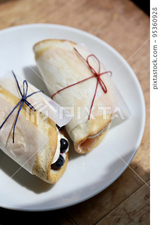 Fruit omelette cake wrapped in glassine paper Fruit omelette cake wrapped in glassine paper 95360928