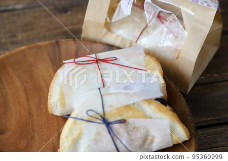 Fruit omelette cake wrapped in glassine paper 95360999