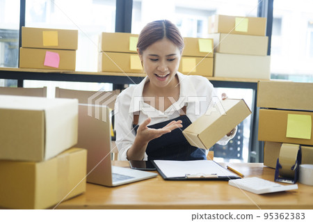 Female online business owner having video call with clients. 95362383