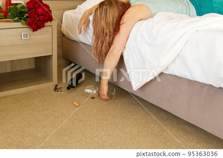 hangover. Young woman sleeping in bed after party at home, hotell hangover. Young woman sleeping in bed after party at home, hotell 95363036