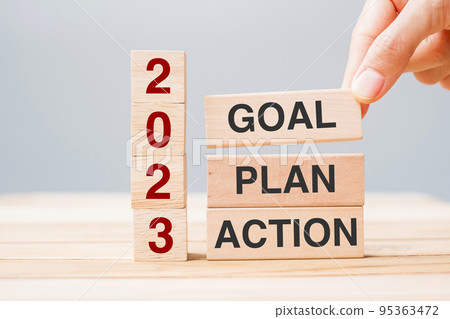 hand holding wooden block with text 2023 GOAL, PLAN and ACTION on table background. Resolution, strategy, solution, goal, business and New Year holiday concepts hand holding wooden block with text 2023 GOAL, PLAN and ACTION on table background. Resolution, strategy, solution, goal, business and New Year holiday concepts 95363472