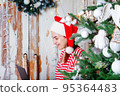 Christmas online shopping. Woman in santa hat. 95364483