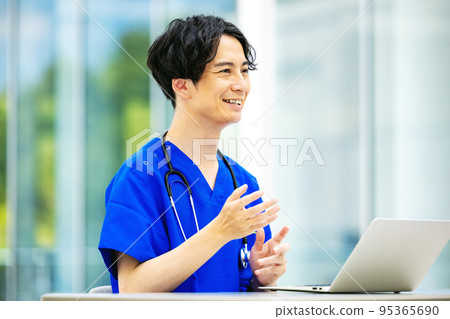 Young doctor working in a hospital Young doctor working in a hospital 95365690