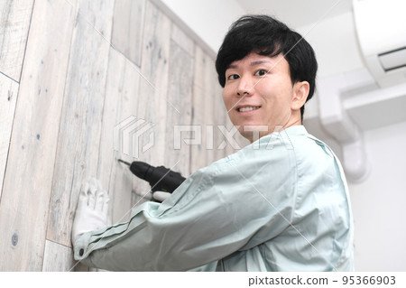 Male worker with electric tools 95366903