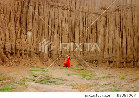 Women and landscape of soil textures eroded sandstone pillars, columns and cliffs, natural erosion of water and wind, Sao Din Na Noi, Hom Chom, Khok Suea at sri nan national park in Nan Province. Women and landscape of soil textures eroded sandstone pillars, columns and cliffs, natural erosion of water and wind, Sao Din Na Noi, Hom Chom, Khok Suea at sri nan national park in Nan Province. 95367007