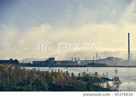 Industrial landscape with heavy pollution produced by a large factory. 95370630