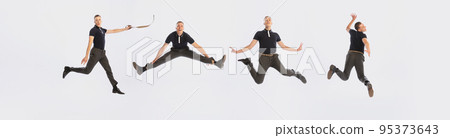 Collage. Cheerful, stylish young man in black suit dancing in weird poses, having fun isolated over grey studio background Collage. Cheerful, stylish young man in black suit dancing in weird poses, having fun isolated over grey studio background 95373643