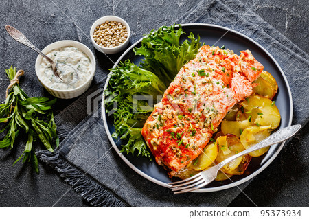 salmon with potato and tarragon sour cream sauce salmon with potato and tarragon sour cream sauce 95373934